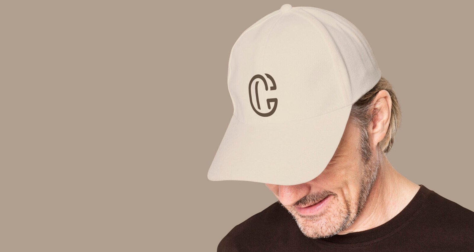 Man in beige cap with C logo for men&rsquo;s apparel shoot